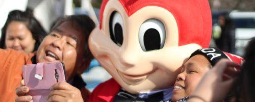 Jollibee mascot posing for a picture