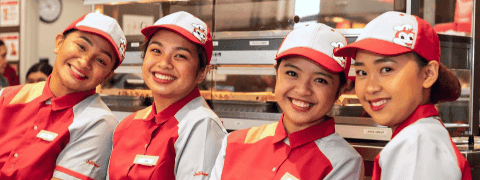 4 smiling Jollibee employees