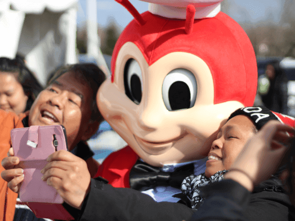 Jollibee mascot posing for a picture